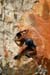 thai_guy_on_orange_wall_2